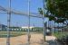 Baseball field.  Backstop and dugout view.