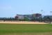 Field 19 view from outfield. Tennis center and cafe in background.