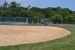 Baseball field view, outfield grass.
